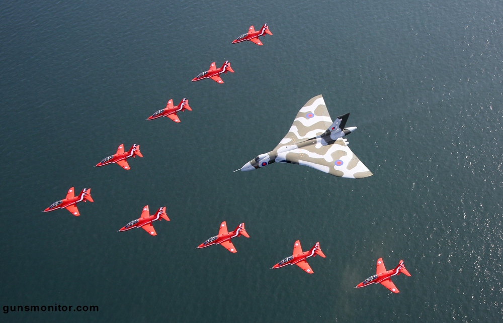 Jets from the Royal Air Force Aerobatic Team performed a flypast with the mighty Cold War aircraft at the Southport Air Show this afternoon (Saturday, September 19th, 2015). Thousands of people cheered and waved as the Red Arrows nine distinctive British-built Hawk aircraft made a V-shape in front of the Vulcan.