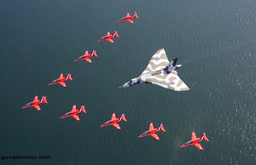  Jets from the Royal Air Force Aerobatic Team performed a flypast with the mighty Cold War aircraft at the Southport Air Show this afternoon (Saturday, September 19th, 2015). Thousands of people cheered and waved as the Red Arrows nine distinctive British-built Hawk aircraft made a V-shape in front of the Vulcan.